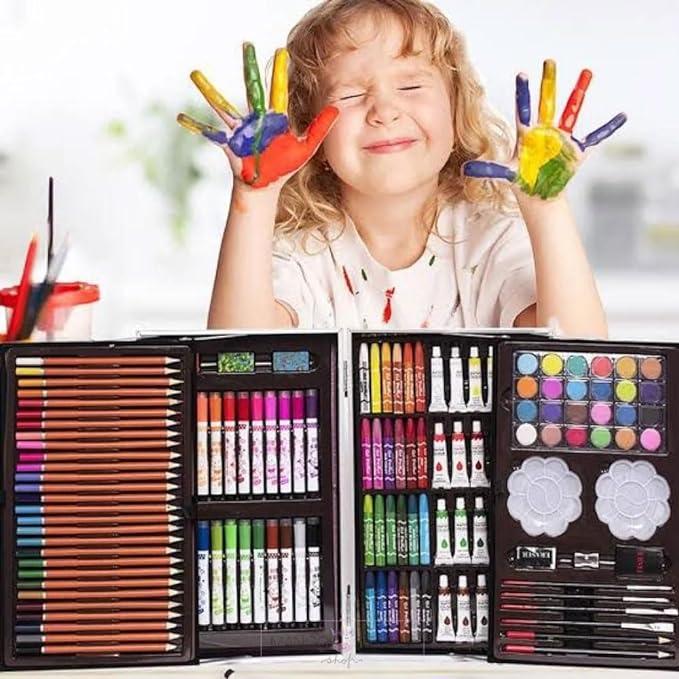 Kid enjoying art and craft kit with colors during summer vacation learning